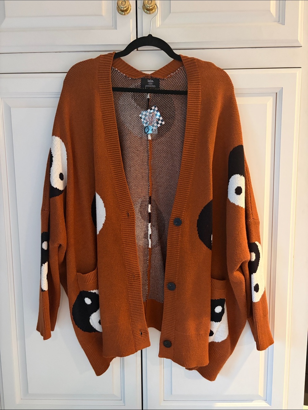 Dressed in LALA - Rust Cardigan with Black & White yin yang. Size S/M.